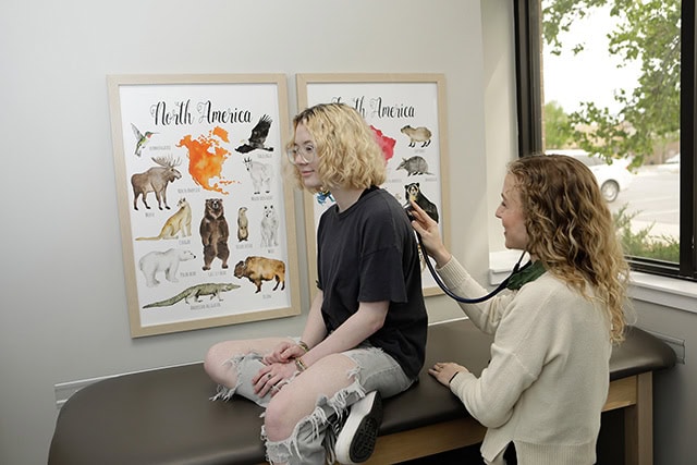 Doctor Listening To A Teen Heart