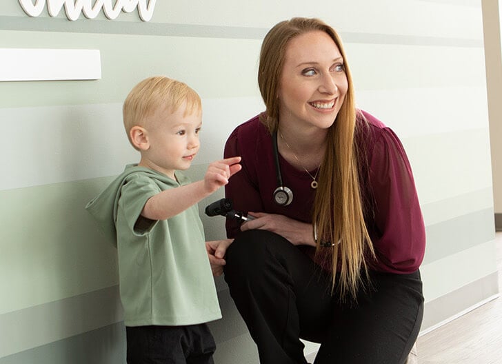 Doctor Welcoming Kid To The Clinic